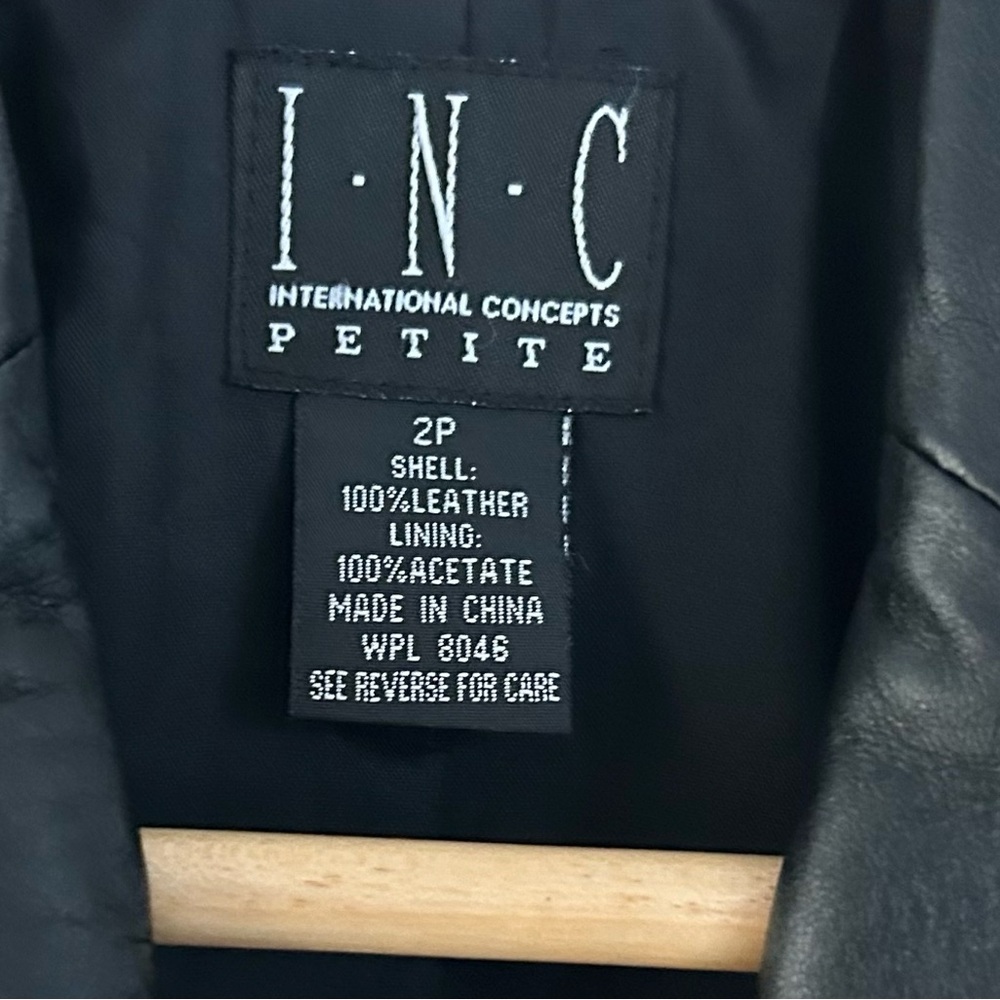 Black leather INC jacket. Stylish and in Excellent condition. Size 2P Comfy fit